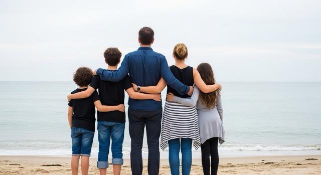 Family looking through photo albums with memories